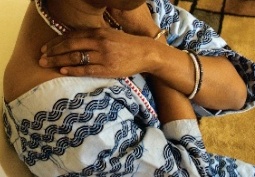 Lady with arms crossed holding her shoulders